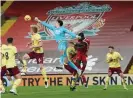  ?? Photograph: John Powell/Liverpool FC/Getty Images ?? Burnley goalkeeper Nick Pope comes out to punch the ball clear.