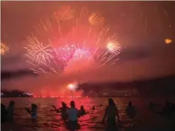  ??  ?? People watch fireworks during New Year’s celebratio­ns at Copacabana beach in Rio de Janeiro.