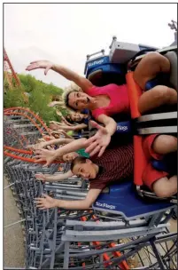  ?? AP/SIX FLAGS NEW ENGLAND ?? People ride the Wicked Cyclone in Agawam, Mass. on May 16. A handful of roller coasters are reopening this year after undergoing extensive rehabs.