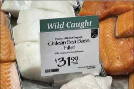  ?? JOSHUA GOODMAN — THE ASSOCIATED PRESS ?? Fillets of Chilean sea bass caught near the U.K.-controlled South Georgia island are displayed for sale at a Whole Foods Market in Cleveland, Ohio.