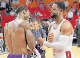  ?? JOHN MCCALL/SUN SENTINEL ?? Heat guard Dwyane Wade gave the shirt off his back to the Kings’ Iman Shumpert as part of his farewell tour.