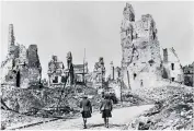  ??  ?? The rubble-strewn streets of Arras in 1917, above