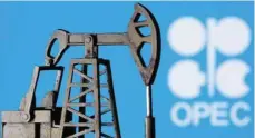  ?? — Reuters ?? A 3D printed oil pump jack is seen in front of displayed Opec logo.