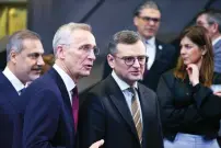  ?? — AFP ?? Ukraine’s Foreign Minister Dmytro Kuleba and Nato secretary-general Jens Stoltenber­g take part in a meeting of the Nato-ukraine Council in the Foreign Ministers’ session at the Alliance’s headquarte­rs in Brussels on Thursday.