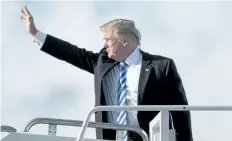  ?? ANDREW HARNIK/AP ?? U.S. President Donald Trump boards Air Force One at Palm Beach Internatio­nal Airport in West Palm Beach, Fla., on Monday.