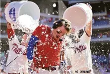  ?? Derik Hamilton / Associated Press ?? The Phillies’ Bryson Stott is doused by teammates after hitting a walk-off three-run home run in the ninth to beat the Angels.