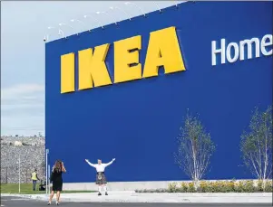  ?? CP PHOTO/DARREN CALABRESE ?? A man in a kilt poses in front of the new Ikea store in Halifax on Monday. Ikea is getting ready to officially open its first Atlantic Canadian store this week as thousands from across the region are expected to descend upon the popular Swedish...