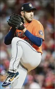  ?? Karen Warren / Houston Chronicle ?? The Astros’ Justin Verlander (35) pitches during Game 5 of the World Series at Citizens Bank Park in Philadelph­ia on Nov. 3. The AL Cy Young winner has reportedly agreed to a 2-year deal with the Mets.