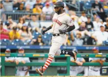  ?? Justin K. Aller / Getty Images ?? Denard Span scores the go-ahead run in the 11th inning after Pittsburgh’s Daniel Hudson bounced a pitch off the plate.