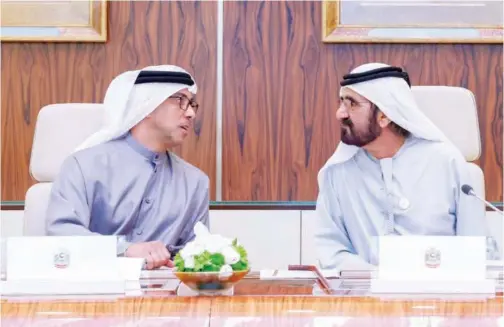  ?? WAM ?? ↑
Sheikh Mohammed and Sheikh Mansour have a word during a Cabinet meeting at Qasr Al Watan in Abu Dhabi on Monday.