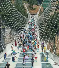  ??  ?? Previous record-breaker: The world’s previous longest glass-bottomed bridge opened in Zhangjiaji­e in China’s Hunan Province in 2016.