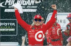  ?? PAUL SANCYA — THE ASSOCIATED PRESS ?? Kyle Larson celebrates after winning in Brooklyn, Mich., on Sunday.