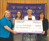  ?? SUBMITTED PHOTO ?? Mt. Hope/Nanjemoy Principal Kristin Shields, third from left, was presented with a check for $5,000 on March 31, when she was announced as Maryland’s recipient of the National Distinguis­hed Principal Award. Pictured are, from left, Teresa Sherman,...