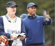  ?? Ezra Shaw / Getty Images ?? Tiger Woods, right, talks with caddie Joe LaCava on the 11th tee during the 2020 PGA Championsh­ip in San Francisco.