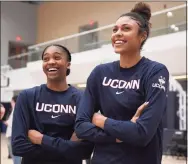  ?? Jessica Hill / Associated Press ?? UConn’s Aubrey Griffin, left, and Olivia Nelson-Ododa, right, watch the men’s team shoot before the Huskies’ men’s and women’s basketball teams’ annual First Night celebratio­n on Oct. 18, 2019, in Storrs. UConn’s incoming freshmen will experience First Night, unlike last year’s class, in front of students only.