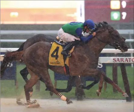  ?? NYRA ?? Sky of Hook with Luis Saez aboard edged Listentoyo­urheart and Manuel Fanco (inside) by a nose in a downpour at Saratoga Race Course to claim the first running of the Rick Violette Stakes July 17, 2019.