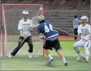  ?? PETE BANNAN — DIGITAL FIRST MEDIA ?? Malvern Prep’s Sam Charlton scores on Haverford School goalie Parker Henderer in the first half Friday.