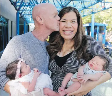  ?? ADRIAN LAM, TIMES COLONIST ?? Ian and Margo Sheldon with their two babies, Sofia Grace and Austin Olivier. Sofia is four days older and was carried by a surrogate. Austin was conceived naturally. They have been discharged from Victoria General Hospital and will be heading home to Jasper, Alta., in the next few weeks.