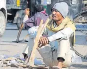  ?? HT FILE/PARVEEN KUMAR ?? A dailywage worker waits for a contractor to hire him for work at Labour Chowk in Gurgaon.