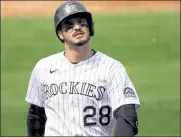  ?? Justin Edmonds / Getty Images ?? The Rockies’ Nolan Arenado walks back to the dugout after lining out during a game against the Athletics on Wednesday at Coors Field in Denver.