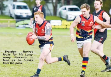  ??  ?? Braydon Munroe looks for his Longwarry forwards to lead as he breaks from the pack.