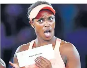  ?? AFP ?? Sloane Stephens reacts after receiving the winner’s cheque at the US Open in New York on Saturday.