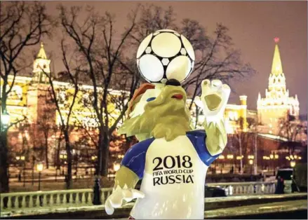  ?? MLADEN ANTONOV/AFP ?? A figure of Zabivaka, the official mascot for the 2018 FIFA World Cup, at Manezhnaya square in downtown Moscow, on Wednesday.