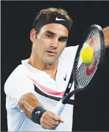  ?? AP PHOTO ?? Switzerlan­d’s Roger Federer makes a backhand return to South Korea’s Hyeon Chung during their semifinal at the Australian Open tennis championsh­ips.