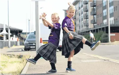  ??  ?? Andrew, 6, and Calum, 8, Wilson from Kelty, start their journey from the Unicorn.