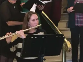  ?? BY CARL HESSLER JR. — MEDIANEWS GROUP ?? Flautist Lisa Tolomeo Higgins performs with the Montgomery County Court House Chorus