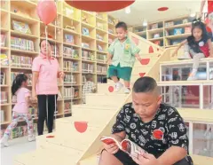  ??  ?? FLIPPING THROUGH: Under the latest renovation at the HSBC Lumpini Park Children’s Library, reading tables and panels are removed to make way for play space.