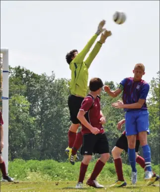  ?? Submitted photo ?? Peterborou­gh City UK Shoppe U16 Boys players, from left, Sam Lackie, Tyler Boothby (goalie) and Noah Wilson show determinat­ion during the Ambassador Cup Boys Soccer Tournament in Kingston, but did not make the playoff round.