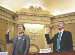  ?? ANDREW HARRER / BLOOMBERG ?? George Kent, deputy assistant U.S. secretary of state, left, and Bill Taylor, acting U.S. ambassador to Ukraine, are sworn in during a House Intelligen­ce Committee impeachmen­t inquiry hearing in Washington, D.C., on Wednesday.
