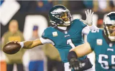  ?? CHRIS SZAGOLA/AP ?? Eagles quarterbac­k Jalen Hurts prepares to make a pass during Monday night’s game vs. Washington.