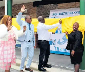  ?? ?? Hillside Aluminum VPO Calvin Mkhabela (centre) unveiling the new building. With him are A Mbatha (deputy principal), SG Pakathi (principal) and Welile Nzamo (DoE district director)