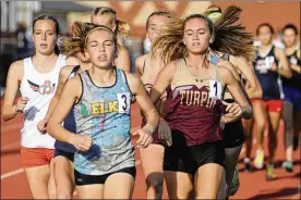  ?? MARC PENDLETON / STAFF ?? Centervill­e sophomore Emma Bucher (3) was runner-up and sophomore Juliann Williams of Beavercree­k (left) fourth in the 1,600 meters during the D-I regional track and field meet at Wayne High School on Friday.