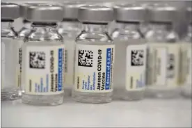  ?? THE ASSOCIATED PRESS FILE PHOTO ?? Vials of Johnson & Johnson COVID-19vaccine in the pharmacy of National Jewish Hospital for distributi­on in east Denver.