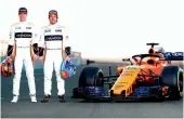  ?? AFP ?? McLaren’s Stoffel Vandoorne ( left) and Fernando Alonso pose with the new car. —