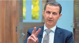  ?? SYRIAN PRESIDENCY PRESS OFFICE/AFP/GETTY IMAGES ?? Syrian President Bashar Assad, interviewe­d Wednesday by Agence France-Presse in Damascus, denied responsibi­lity for a chemical weapons attack.