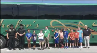  ?? PHOTO COURTESY ONEIDA COUNTY SHERIFF’S OFFICE ?? Deputy Dominick Belmonte and Officer John Curley, both left, stand with children before they head off to 2019’s New York State Sheriffs’ Institute Summer Camp on Sunday, Aug. 4. To the right is Undersheri­ff Joseph Lisi.