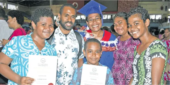  ?? Photo: Vilimoni Vaganalau ?? Bachelor of Dietetics and Nutrition graduate and Certificat­e of Exellence and Dean’s Honours recipient Ilisabeta Sili with family members at the Fiji National University graduation on December 12, 2017.