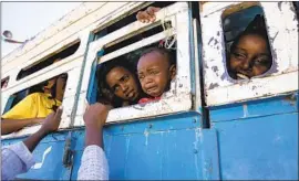  ?? Nariman El- Mofty Associated Press ?? REFUGEES ARE BUSED to a shelter near the Ethiopia- Sudan border Dec. 1. Fighting that broke out Nov. 4 in Ethiopia’s Tigray region has killed thousands.