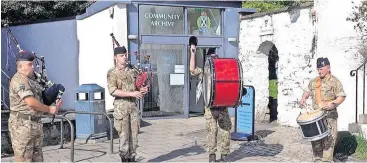  ?? ?? Tradition Bagpipers and drummers at the re-enactment