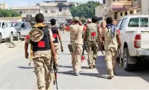  ??  ?? CLEARING OPERATION: Members of the forces loyal to Libya’s UN-backed Government of National Accord (GNA) walk toward their positions in the coastal city of Sirte, on Sunday. (AFP)