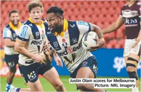  ??  ?? Justin Olam scores for Melbourne. Picture: NRL Imagery