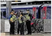  ??  ?? Police provide security at Paddington train station in London after a terrorist incident at nearby Parsons Green subway station Friday. A bucket wrapped in an insulated bag exploded.