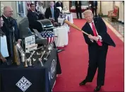  ?? EVAN VUCCI — THE ASSOCIATED PRESS ?? President Donald Trump swings a baseball bat during the Spirit of America Showcase at the White House in Washington on Thursday.