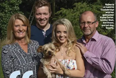  ??  ?? Rebecca at home in Castlebrid­ge withher godmother Elaine Carter, brother Niall, dad Shane, and pet dog, Scruffy.