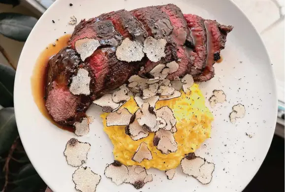  ?? Photos by Mike Sutter/Staff ?? The impressive steak and eggs can be upgraded with shaved truffle and rich, brown demi-glace, a decision your taste buds will applaud.