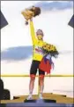  ?? Thibault Camus Associated Press ?? TADEJ POGACAR of Slovenia won cycling’s showpiece race one day before his 22nd birthday.